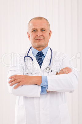 Mature doctor male with stethoscope cross arms