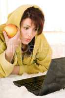 woman with laptop and apple