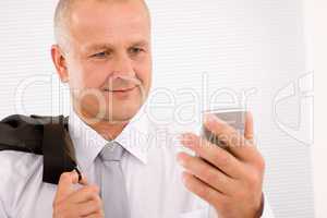 Mature businessman hold phone close-up portrait