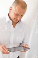 Businessman mature hold touch tablet computer