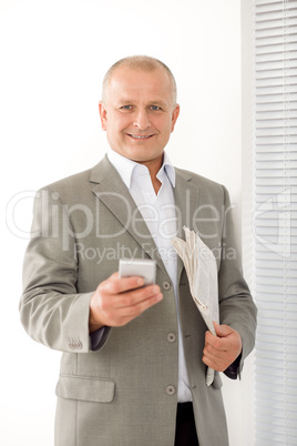 Businessman mature smiling hold phone portrait