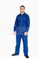 Smiling young mechanic in boiler suit