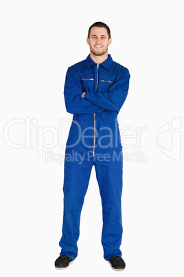 Smiling mechanic in boiler suit