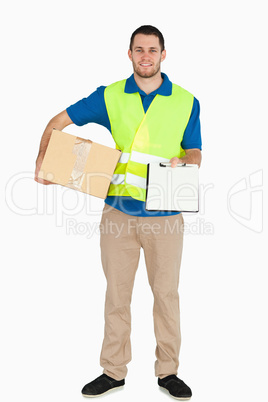 Smiling young delivery man asking for signature