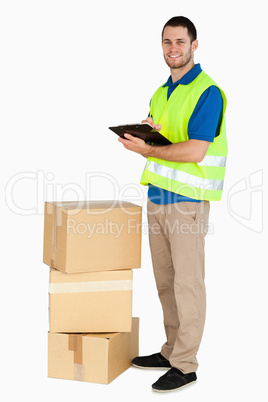 Side view of smiling young delivery man