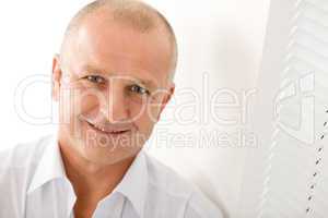 Mature businessman smile posing close-up portrait
