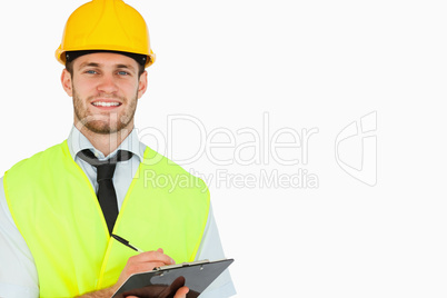 Smiling young lead worker with clipboard