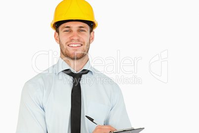 Smiling young lead worker with his clipboard