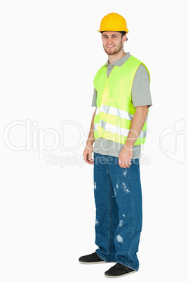 Side view of smiling young construction worker