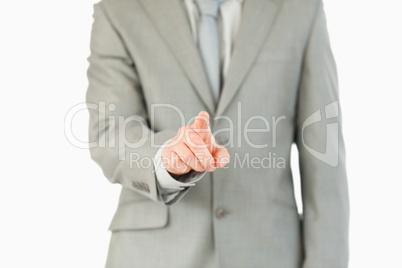 Businessman's finger activating futuristic touchscreen