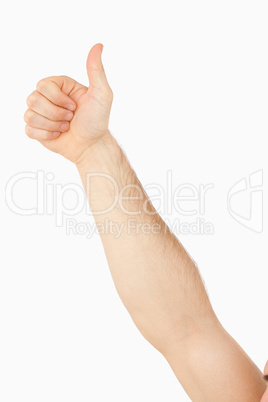 Side view of male arm giving thumb up