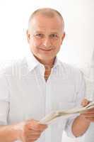 Senior businessman happy read newspapers portrait