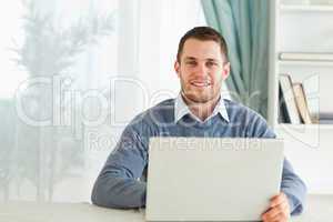 Man with his notebook in his homeoffice