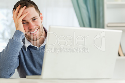 Smiling businessman tired in his homeoffice
