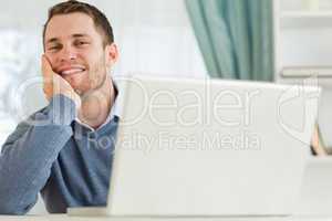 Businessman smiling tired in his homeoffice