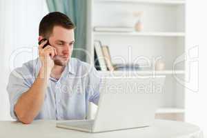 Businessman in his homeoffice calling