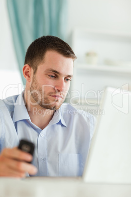 Businessman with notebook and cellphone