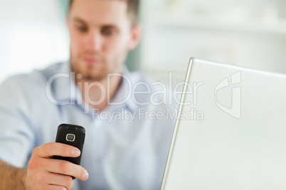 Mobile phone being used by businessman