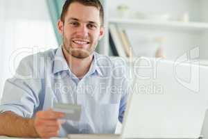 Businessman with notebook and credit card