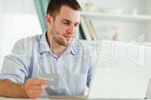 Businessman with laptop and credit card