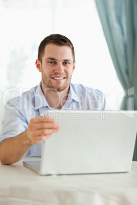 Businessman on his laptop behind a desk