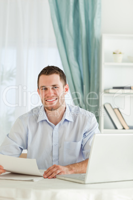 Happy businessman with a letter