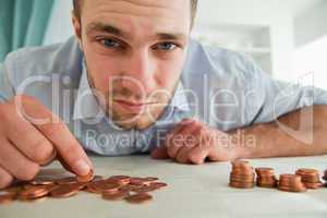 Desperate businessman counting his change