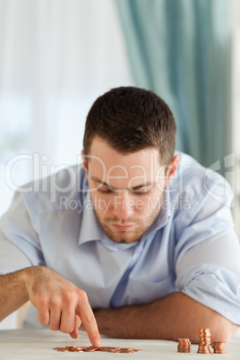 Desperate businessman counting change