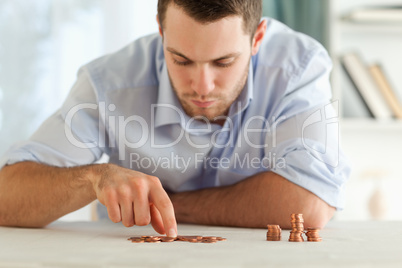 Businessman counting his small coins