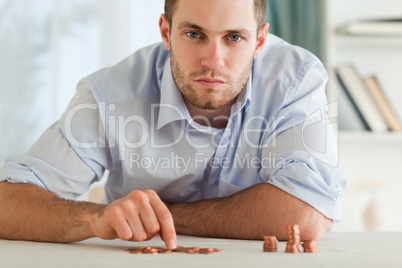 Desperate businessman counting his small coins