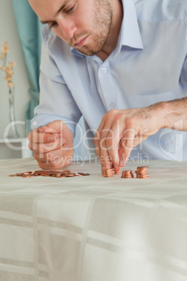 Desperate businessman counting his small change