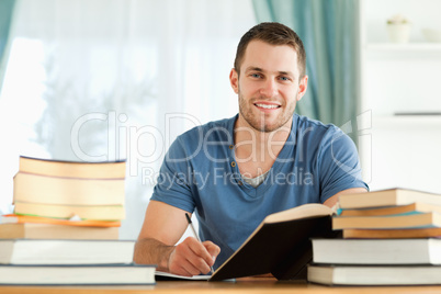 Smiling student preparing for exam