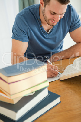 Smiling student doing book report