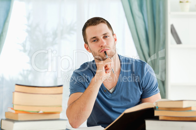 Student sitting at his desk doing his homework