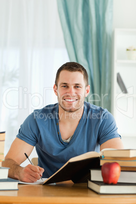 Smiling student happy about his progress