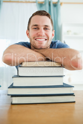 Happy student with his books