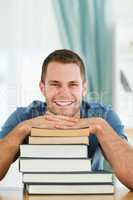 Smiling student with his books