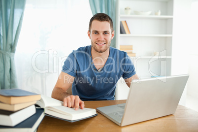 Smiling student happy about his research results