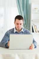 Man with his laptop in his homeoffice