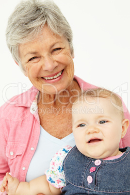 Portrait of senior woman with baby