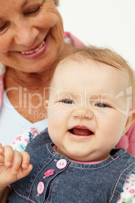 Portrait of senior woman with baby