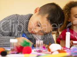 Young mixed race children doing handicrafts