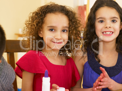 Young mixed race children doing handicrafts