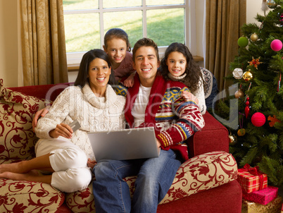 Hispanic family Christmas shopping online