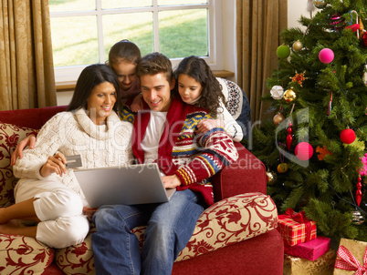 Hispanic family Christmas shopping online