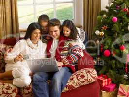 Hispanic family Christmas shopping online