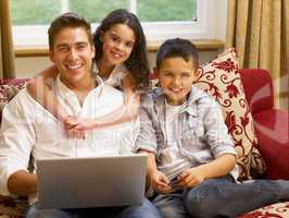 Hispanic father and children shopping online