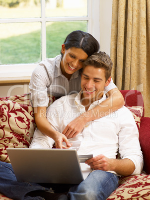 Young Hispanic couple shopping online