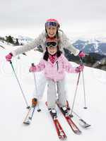 Young Mother And Daughter On Ski Vacation