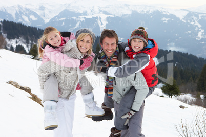 Young Family On Winter Vacation